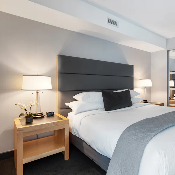 A hotel bedroom made up by housekeeping