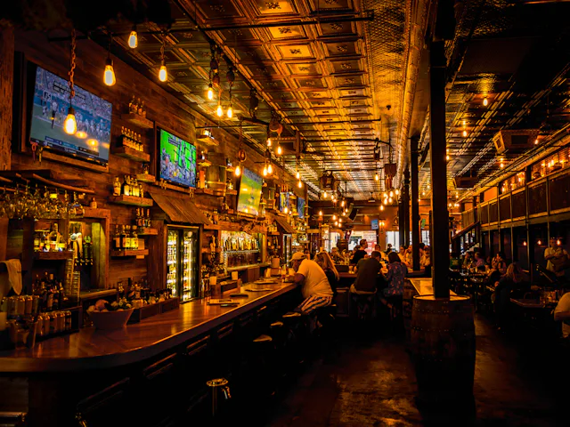 A warmly lit private members' club bar